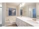 Bathroom boasts double vanity, a bathtub, and a separate shower at 1650 Willow Way, Woodstock, GA 30188