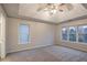 Spacious bedroom with carpet and multiple windows at 1650 Willow Way, Woodstock, GA 30188