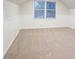 Cozy bedroom with carpet, window, and wood paneling at 1650 Willow Way, Woodstock, GA 30188