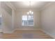 Bright dining room with hardwood floors and chandelier at 1650 Willow Way, Woodstock, GA 30188