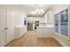 Modern kitchen with white cabinets and stainless steel appliances at 1650 Willow Way, Woodstock, GA 30188