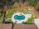 Home with a kidney-shaped pool and fenced backyard at 1907 Old Loganville Rd, Loganville, GA 30052