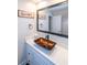 Modern bathroom with a vessel sink, white vanity, and framed mirror at 1907 Old Loganville Rd, Loganville, GA 30052