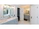 Modern bathroom with dual vanity, grey cabinets, and marble countertops at 1907 Old Loganville Rd, Loganville, GA 30052