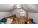 Upstairs bedroom with two twin beds and wood flooring at 1907 Old Loganville Rd, Loganville, GA 30052