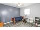 Small bedroom with gray accent wall and twin bed at 1907 Old Loganville Rd, Loganville, GA 30052