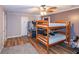 Bedroom with two bunk beds and wood flooring at 1907 Old Loganville Rd, Loganville, GA 30052