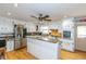 Spacious kitchen featuring granite countertops, stainless steel appliances, and ample cabinetry at 1907 Old Loganville Rd, Loganville, GA 30052