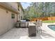 Outdoor kitchen with stainless steel appliances and granite countertop at 1907 Old Loganville Rd, Loganville, GA 30052