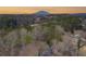 Aerial view of home with a view of Stone Mountain in the distance at 517 Stonehedge Dr, Stone Mountain, GA 30087