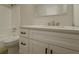 Renovated bathroom featuring a white vanity and updated fixtures at 517 Stonehedge Dr, Stone Mountain, GA 30087