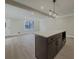 Dark brown kitchen island with white quartz countertop at 517 Stonehedge Dr, Stone Mountain, GA 30087