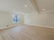 Large living room with light gray walls and wood-look floors at 517 Stonehedge Dr, Stone Mountain, GA 30087