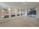 Sunlit room with multiple windows and sliding glass doors to deck at 517 Stonehedge Dr, Stone Mountain, GA 30087