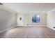 Spacious living room with light gray walls and wood-look flooring at 517 Stonehedge Dr, Stone Mountain, GA 30087