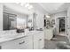 Elegant bathroom with double vanity and marble countertops at 5710 Breitling Dr, Cumming, GA 30028