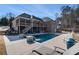 Luxury pool with spacious deck and multiple lounge chairs at 5710 Breitling Dr, Cumming, GA 30028