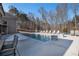 Inviting, rectangular pool with plenty of lounge chairs at 5710 Breitling Dr, Cumming, GA 30028