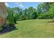 Large backyard with lush green grass at 647 Shannon Green Cir, Mableton, GA 30126