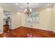 Bright dining room with hardwood floors and chandelier at 647 Shannon Green Cir, Mableton, GA 30126