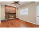 Bright living room with hardwood floors and brick fireplace at 647 Shannon Green Cir, Mableton, GA 30126