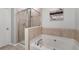 Bathroom with shower and garden tub at 704 Woodland, Woodstock, GA 30188