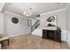 Bright dining area with hardwood floors and elegant chandelier at 704 Woodland Pl, Woodstock, GA 30188