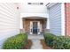 Welcoming front entrance with stone accents and lush landscaping at 704 Woodland, Woodstock, GA 30188