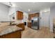 Kitchen boasts granite countertops and stainless steel appliances at 704 Woodland Pl, Woodstock, GA 30188