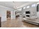 Spacious living room with high ceilings, fireplace and hardwood floors at 704 Woodland Pl, Woodstock, GA 30188