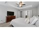 Main bedroom with TV and ensuite bathroom at 704 Woodland Pl, Woodstock, GA 30188