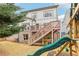 Large backyard with deck, playset, and mature trees at 370 Park Ne Pl, Atlanta, GA 30317