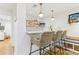 Basement bar with a white quartz countertop, teal cabinets, and woven barstools at 370 Park Ne Pl, Atlanta, GA 30317