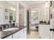 Bathroom with dark vanity, white cabinets and a shower at 370 Park Ne Pl, Atlanta, GA 30317