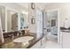 Bathroom with dark vanity, white cabinets and a window at 370 Park Ne Pl, Atlanta, GA 30317