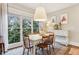 Charming breakfast nook with white table and wooden chairs, overlooking a garden at 370 Park Ne Pl, Atlanta, GA 30317