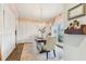 Bright dining room with chandelier, farmhouse table and chairs, and large windows at 370 Park Ne Pl, Atlanta, GA 30317