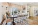 Spacious dining area with a large table, white chairs, and a beautiful rug at 370 Park Ne Pl, Atlanta, GA 30317