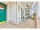 Brick front porch with seating area and ceiling fan at 370 Park Ne Pl, Atlanta, GA 30317