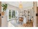 Well-lit home office featuring a white desk, built in shelving and hardwood floors at 370 Park Ne Pl, Atlanta, GA 30317