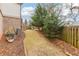 Landscaped side yard with mature trees and shrubs at 370 Park Ne Pl, Atlanta, GA 30317