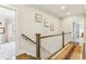 Elegant upstairs hall with hardwood floors and a stylish runner at 370 Park Ne Pl, Atlanta, GA 30317