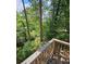 Deck provides scenic view of wooded backyard and water at 387 Lassetter Rd, Sharpsburg, GA 30277