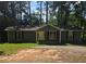 Ranch style home with gray siding, and a spacious front yard at 387 Lassetter Rd, Sharpsburg, GA 30277