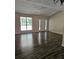 Bright living room with hardwood floors and lots of natural light at 387 Lassetter Rd, Sharpsburg, GA 30277