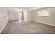 Large carpeted basement featuring natural light and convenient access to other rooms at 4196 Jami Ln, Snellville, GA 30039