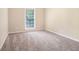 Inviting bedroom with carpet, neutral walls, and a bright window at 4196 Jami Ln, Snellville, GA 30039