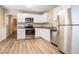 Modern kitchen featuring stainless steel appliances and white cabinets at 4196 Jami Ln, Snellville, GA 30039