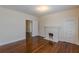 Spacious bedroom with hardwood floors and a white brick fireplace at 523 North Ave, Hapeville, GA 30354