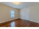 Hardwood floors and neutral walls in this well-lit bedroom at 523 North Ave, Hapeville, GA 30354